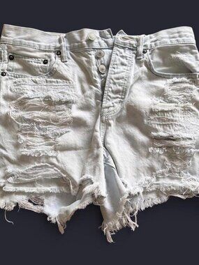 American Eagle white denim distressed jean shorts. Size 4